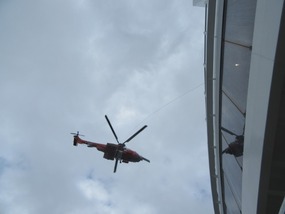 Helicopter taking an ill person off the ship
