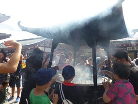 People trying to inhale the smoke