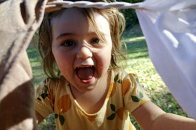 Peeking through the clothes on the line