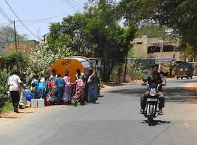Getting water from the water truck