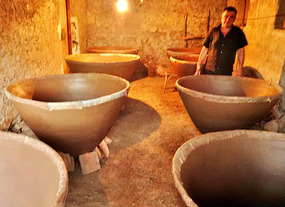 Layer by layer, clay is added to form Qvevri jars