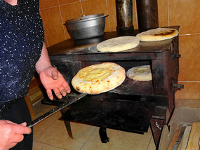 Baking Kachapuri (Georgian cheese pie)
