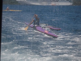 Canoer riding our tender's wake