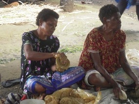 Women making pots