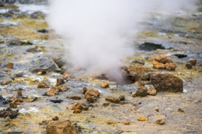 Escaping steam from hole in the ground