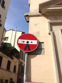 No entry sign with a man in the stocks