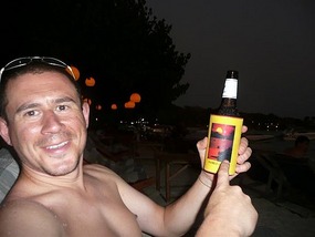 Chilling at sunset on the island with a beer.