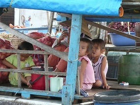 House boat river children at the markets...