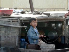 Young Vietnamese boy on the river....
