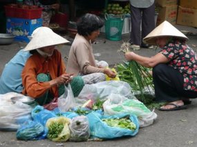 Vietnamese ladies selling veg on the streets