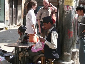 Local man sewing on the streets