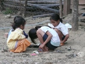 Loca children playing in the mud