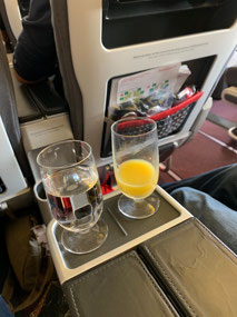 Before flight drink in REAL glassware.
