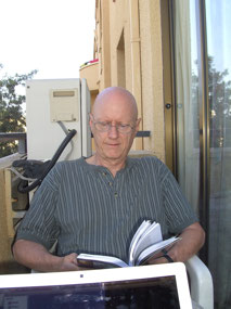 Mike reading on the balcony