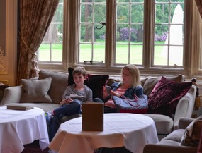 Mother and son awaiting their tea
