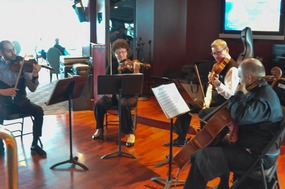 The string quartet playing at high tea