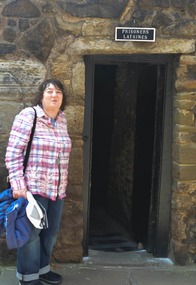 Melissa entering the prisoner's latrine