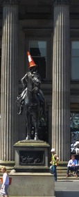 Wellington topped by a traffic cone