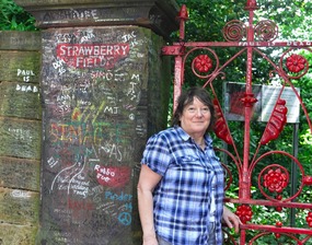 Melissa at the gate to Strawberry Fields