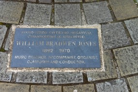 Plaque on ground near guitarist