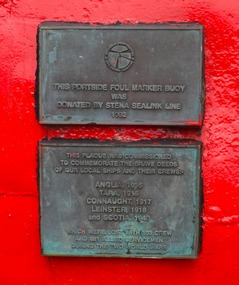 Plaques on a buoy outside museum