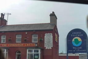 Welcome sign and Edinburgh Castle