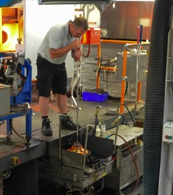 Blowing the glass into shape