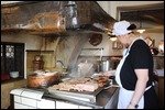 Cooking sausages at the green kitchen