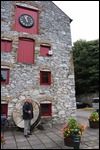 Old grinding wheel behind Peter
