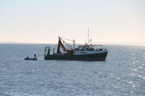 Boarding the fishing trawler at Yacht Club Bay