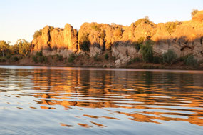 Reflection distorted by the ripples from boat