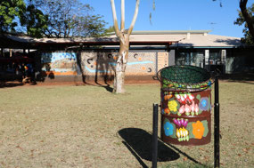 Another bin & mural on building behind