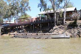 Sawmill on the wharf & barge with logs