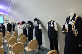 Uniforms lined either side of room