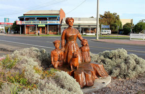 Mother & children wood carving in LE