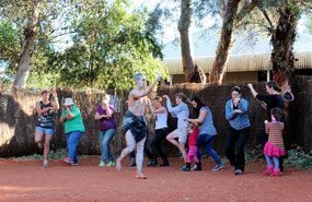 Tourists having fun doing the Emu dance
