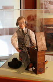 Porcelain doll of John Flynn at 'John Flynn Place'