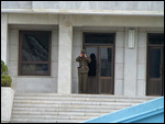 Watched through binoculars by a KPA soldier
