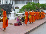 Monks receiving alms