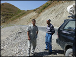 Driver (with cap) and co-passenger