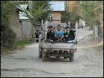 Boys on the back of a truck 