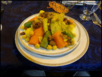 Couscous topped with steamed vegetables
