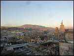 Rooftop view of Fes medina at sunset