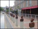 Wooden busts at Mary Fitzgerald Square