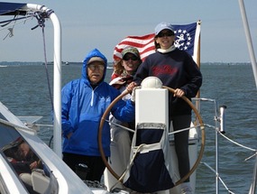 Joe, Betsy and Donna at the helm