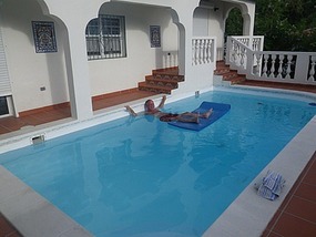 Larry relaxes at John's villa
