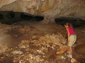 Exploring the cave with flashlight
