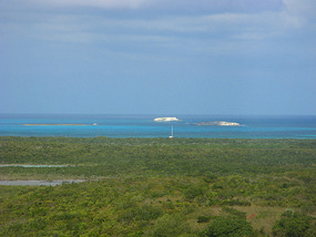 View from lighthouse of Pas de Deux at anchor 