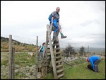 The correct way to climb the deer stile is...
