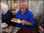 Jim has got his cream tea at last!